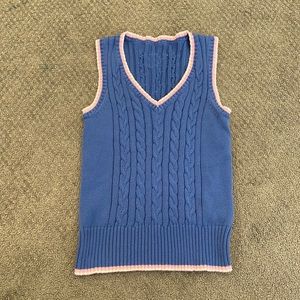 Blue sweater vest with pink lining